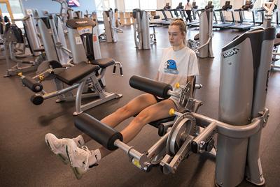 student working out in fitness center